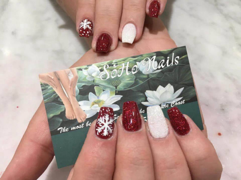 beautiful christmas nails holding soho nails business card